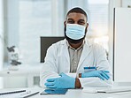 Portrait, desk and black man or doctor with face mask for covid, virus or sick at hospital. Expert, office and African nurse or surgeon at a table or workspace for medical, healthcare or clinic job