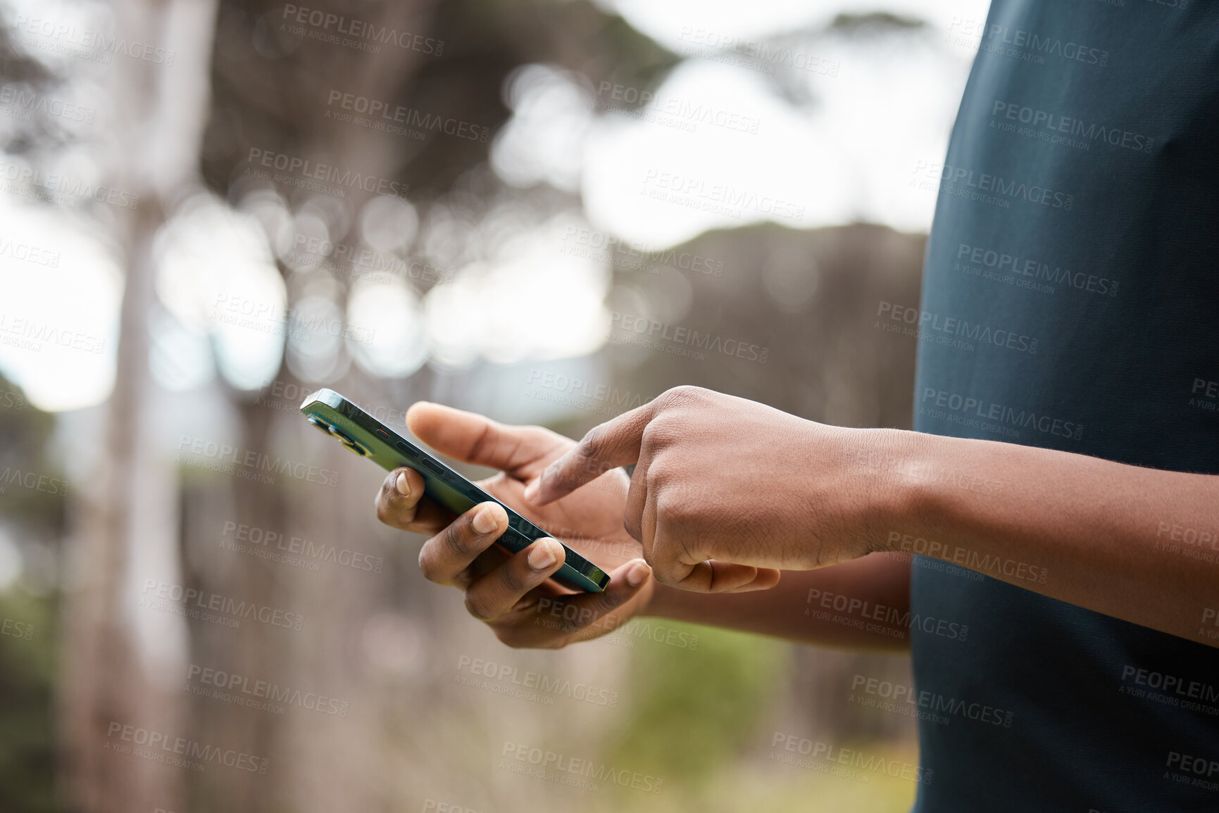 Buy stock photo Man, hands and phone in fitness, social media or outdoor networking for communication in nature. Closeup of male person typing in online texting, sports research or chatting on mobile smartphone app