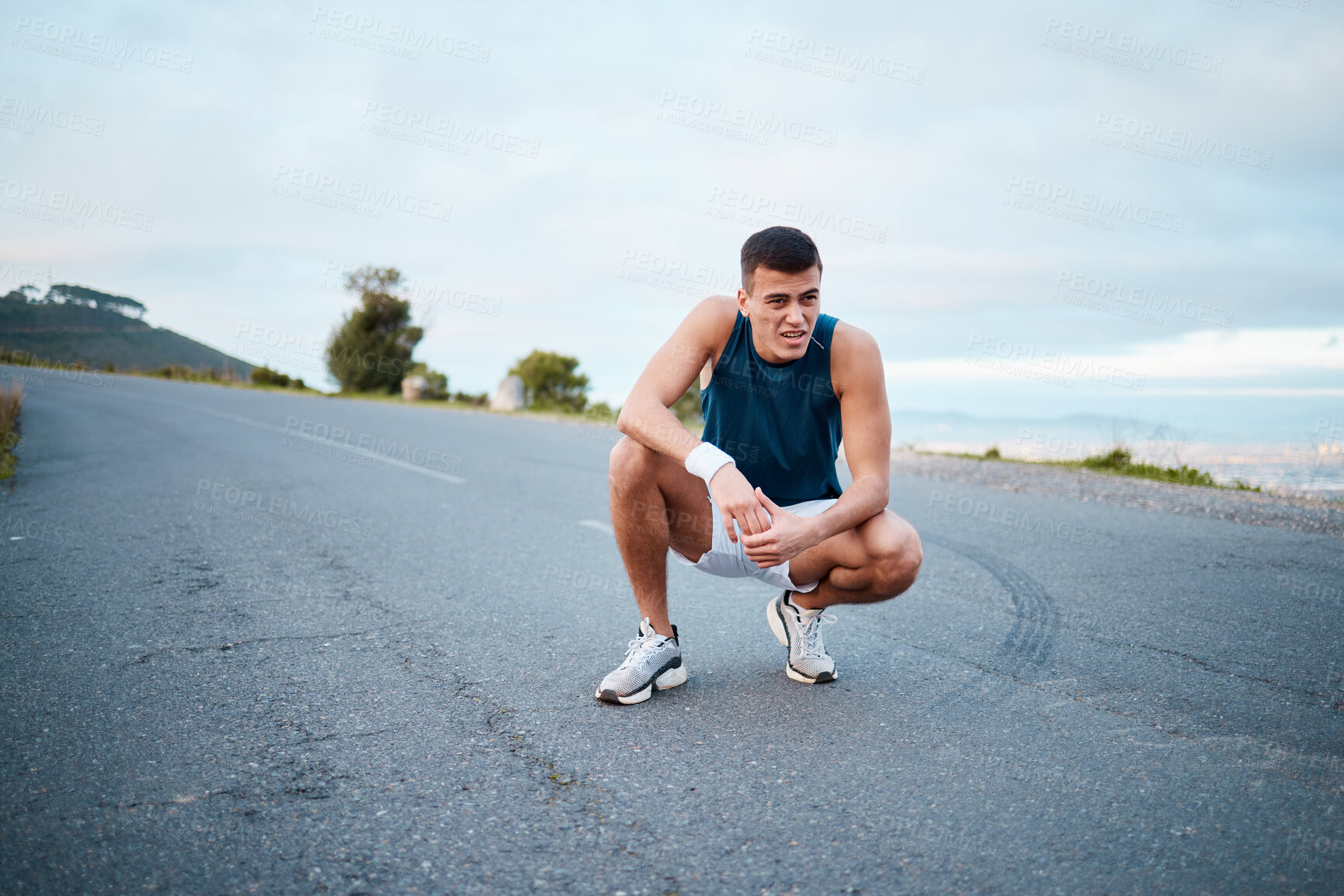 Buy stock photo Sports, nature and man athlete breathing on break of race, marathon or competition training and workout. Fitness, fatigue and tired young male runner resting for outdoor cardio exercise for endurance