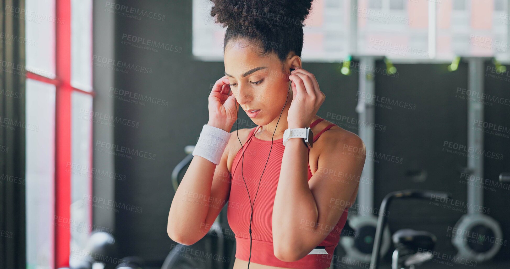 Buy stock photo Woman, gym and earphones for music, thinking and listening for inspiration to workout for wellness. African girl, audio streaming subscription and hearing for exercise, training or fitness with sound