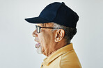 Smile, senior and side profile of a man on a studio background for fashion, relax or retirement. Happy, looking and an elderly person on a wall or backdrop for thinking, idea or stylish with clothes