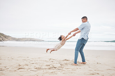 Buy stock photo Swinging, happy and a father and child at the beach for fun, bonding and love in summer for vacation. Playful, laughing and a young dad spinning a girl kid at the ocean for freedom and love together