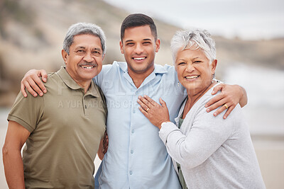 Buy stock photo Man, senior parents or portrait at beach for bond, support or love with smile, care or pride in retirement. Hug, ocean or mature mother with a happy son at sea together on family holiday vacation