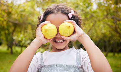 Buy stock photo Lemon on eyes, smile and girl on farm for harvest, sustainable farming and growth in nature. Agriculture, childhood and happy kid with fruit for nutrition, healthy eating and organic food in garden