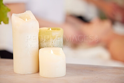 Buy stock photo Zen, table and candles at spa during massage for relax, wellness and lighting at a hotel. Calm, peace and a flame in a room for a luxury treatment, aroma therapy or ambient experience for hospitality