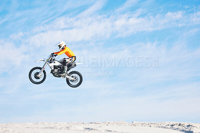 Buy stock photo Motorbike, jump and man in the air with blue sky, mock up and stunt in sports with fearless person in danger with freedom. Motorcycle, jumping and athlete training for challenge or competition