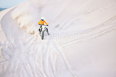 Buy stock photo Motorcycle, desert and extreme sports in race, adrenaline and training for fitness in competition. Athlete, dust and mockup by sand dunes, driving and dirt bike in outdoor for stunt or performance