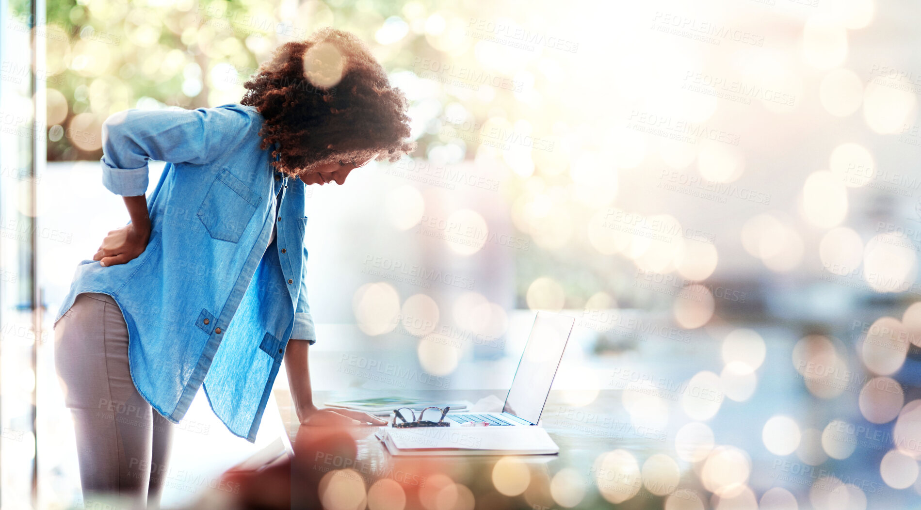 Buy stock photo Laptop, backache and posture with a business woman holding her spine in pain at the office for work. Computer, space and a young design employee feeling an injury to her body on double exposure