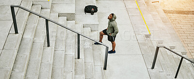 Buy stock photo Tired black man, stairs and fitness on break from running, exercise or outdoor workout in city. Banner of African male person, athlete or runner in rest, recovery or training on steps in urban town