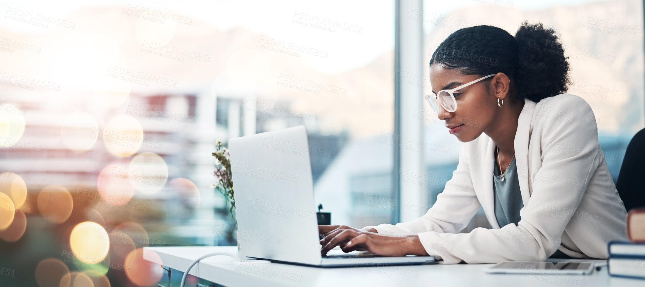 Buy stock photo Businesswoman, laptop and typing a proposal in corporate office, agenda and report or schedule. African person, research and review or email via internet, digital and technology with bokeh in mockup