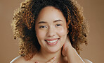 Portrait of happy model, natural beauty dermatology and cosmetic wellness in studio with smile. Skin glow, proud woman or confident biracial female person with skincare results on brown background