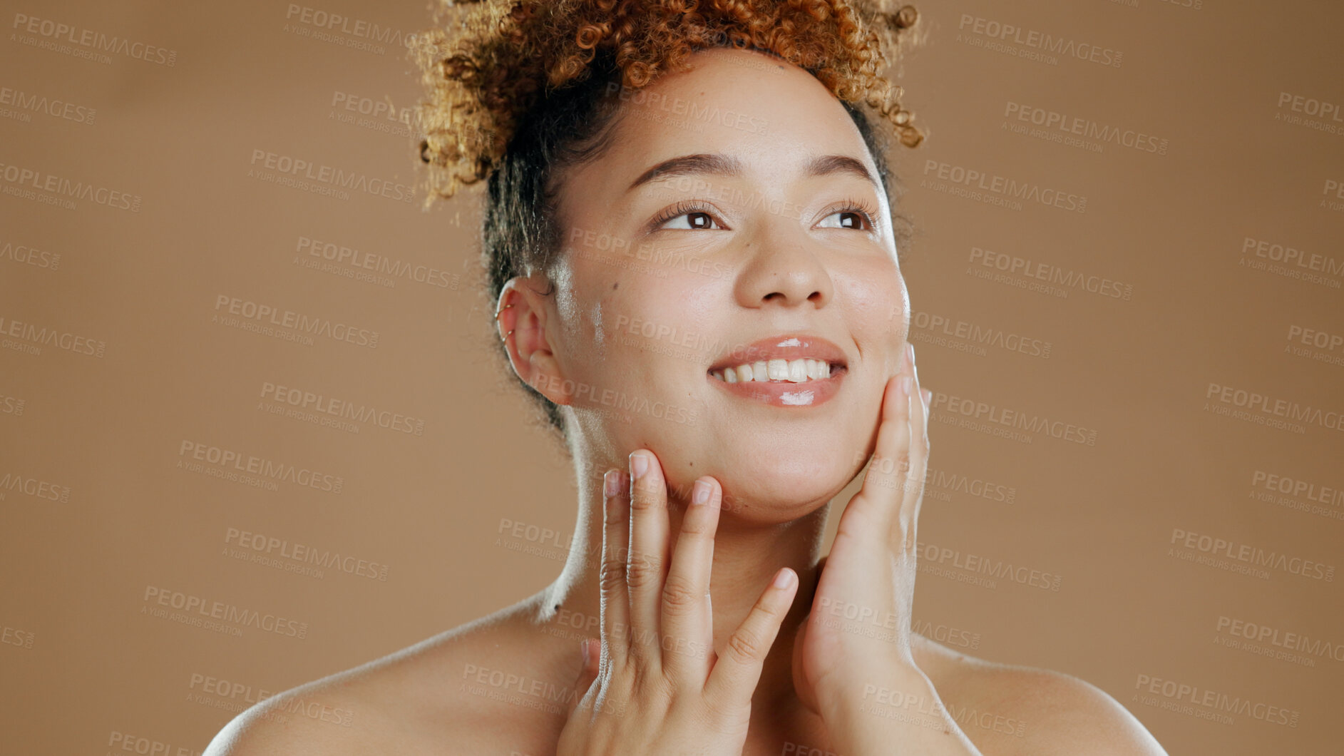 Buy stock photo Woman, beauty and touch face for skincare cosmetics in studio isolated on brown background. Hand, natural and happy model thinking in spa facial treatment for glow, health or wellness of smooth skin