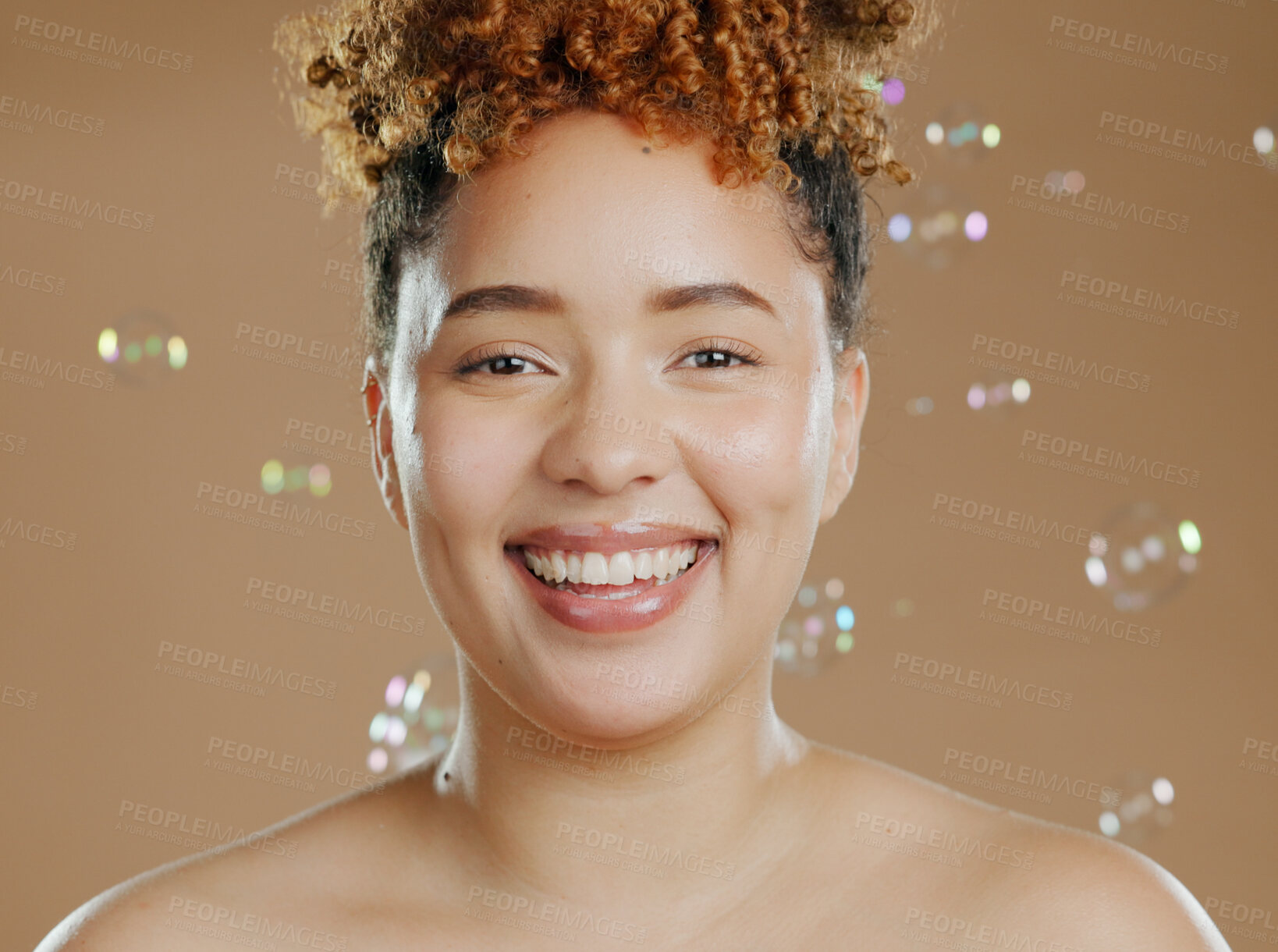 Buy stock photo Happy woman in portrait, bubbles and skincare for beauty, natural cosmetics and glow on brown background. Dermatology, wellness for skin and liquid soap with self care and anti aging in studio
