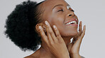 Happy black woman, face and smile for skincare, natural beauty or cosmetics against a studio background. Closeup of calm African female person or model in relax for spa, facial treatment or soft skin