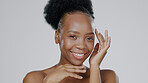 Face, skincare and hands of happy black woman in studio isolated on a gray background for aesthetic. Portrait, touch and natural beauty cosmetics of model in spa facial treatment, wellness and health