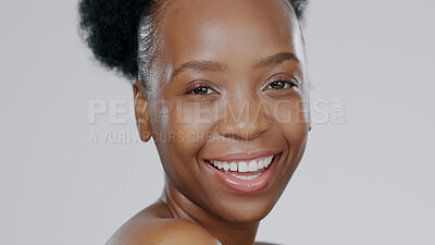 Buy stock photo Portrait, skincare and smile with a happy black woman in studio on a gray background for natural wellness. Face, beauty and aesthetic with a happy young model closeup for antiaging skin treatment