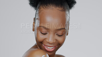 Buy stock photo Woman, face and body for cream or moisturizer, cosmetic and beauty with smile in studio. African model, glow and dermatology with lotion for skincare aesthetic and skin health with grey background 