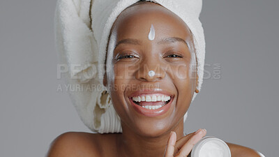 Buy stock photo Woman, moisturizer and smile in portrait for skincare or beauty, health and wellness or dermatology. Happy black person, skin and cosmetics for hydration, care and creme in studio by gray background 
