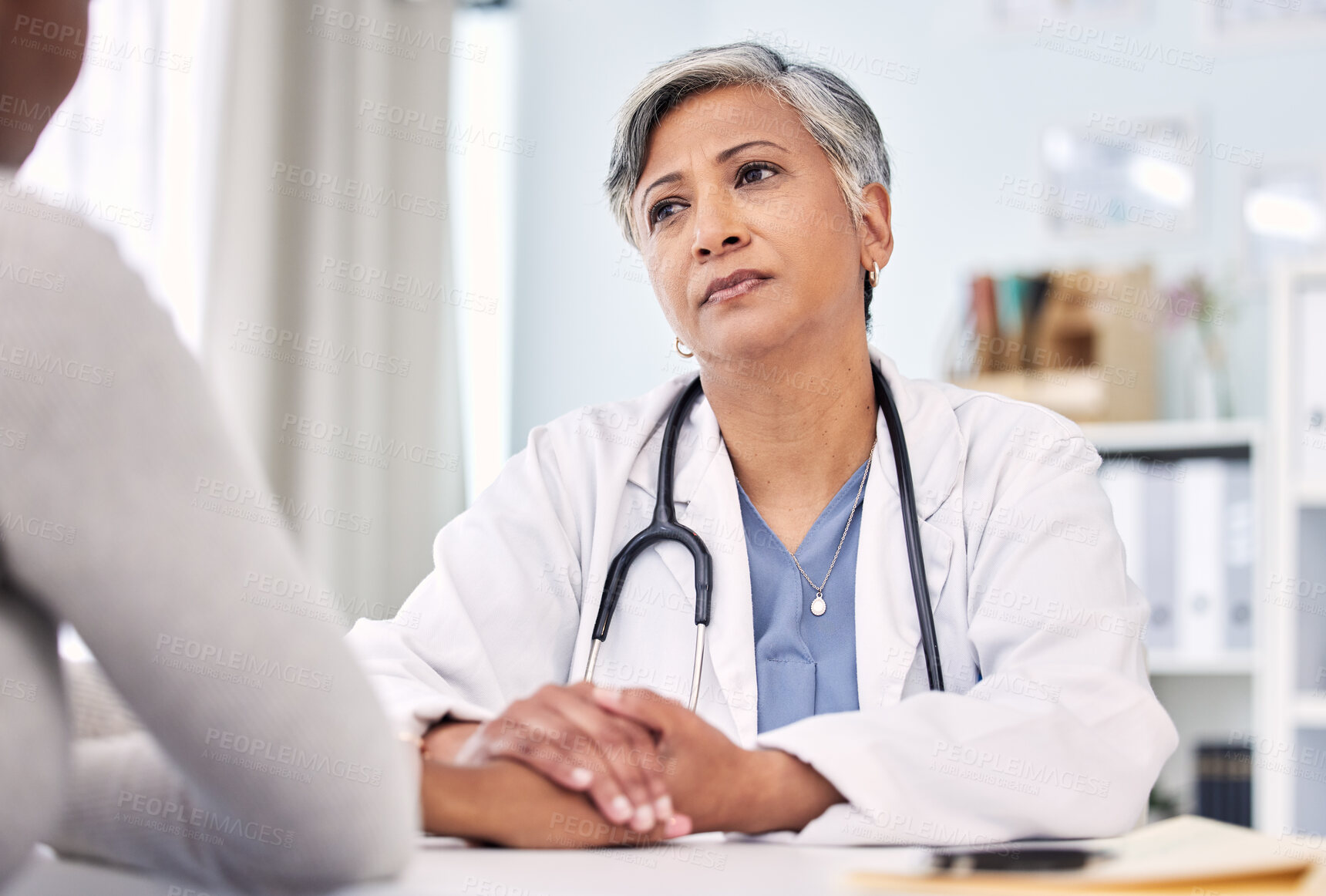 Buy stock photo Medical, holding hands and doctor with woman in clinic for support. empathy or care. Checkup, discussion and closeup of female healthcare worker with sympathy for patient in medicare hospital.