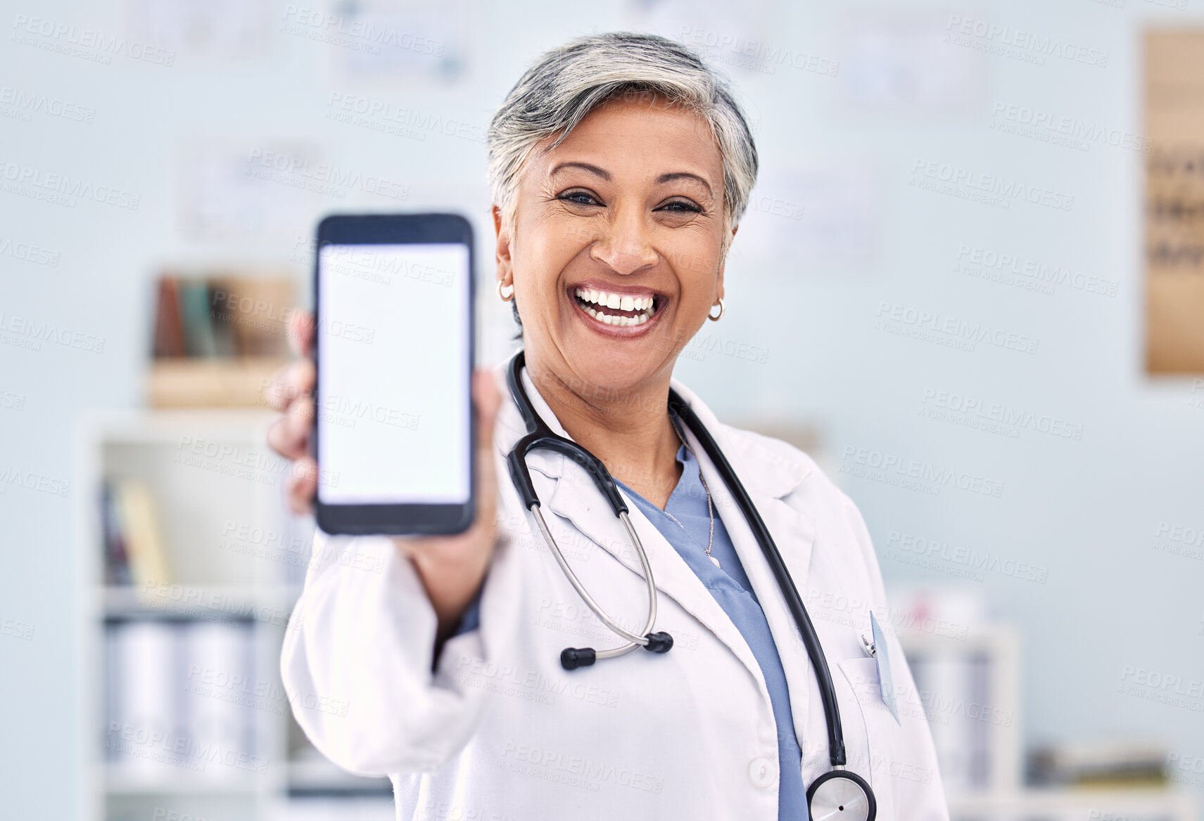 Buy stock photo Phone screen, senior woman and doctor with advertising mockup and portrait, app and ads with telehealth. Social media promo, smartphone and healthcare information on website with smile at clinic