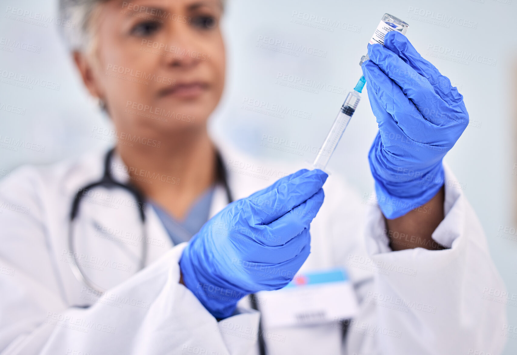 Buy stock photo Hands, doctor with needle and vaccine bottle for health, safety from virus and medicine at clinic. Pharmaceutical drugs, senior woman has container and syringe for immunity, healthcare and wellness 