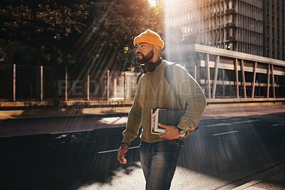 Buy stock photo Man in city, university books and walking on morning commute to campus for education with backpack. Learning, opportunity and college student on urban street with school notebook, knowledge and sun.