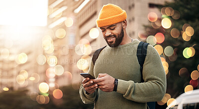 Buy stock photo Phone, man and outdoor chat, network and social media for startup business or freelance marketing in city bokeh. African person typing on mobile for information, contact or travel FAQ in urban street