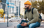 Happy man sitting in city with university books and smile on morning relax at campus for education with backpack. Learning, studying and college student waiting on urban street with school notebook.