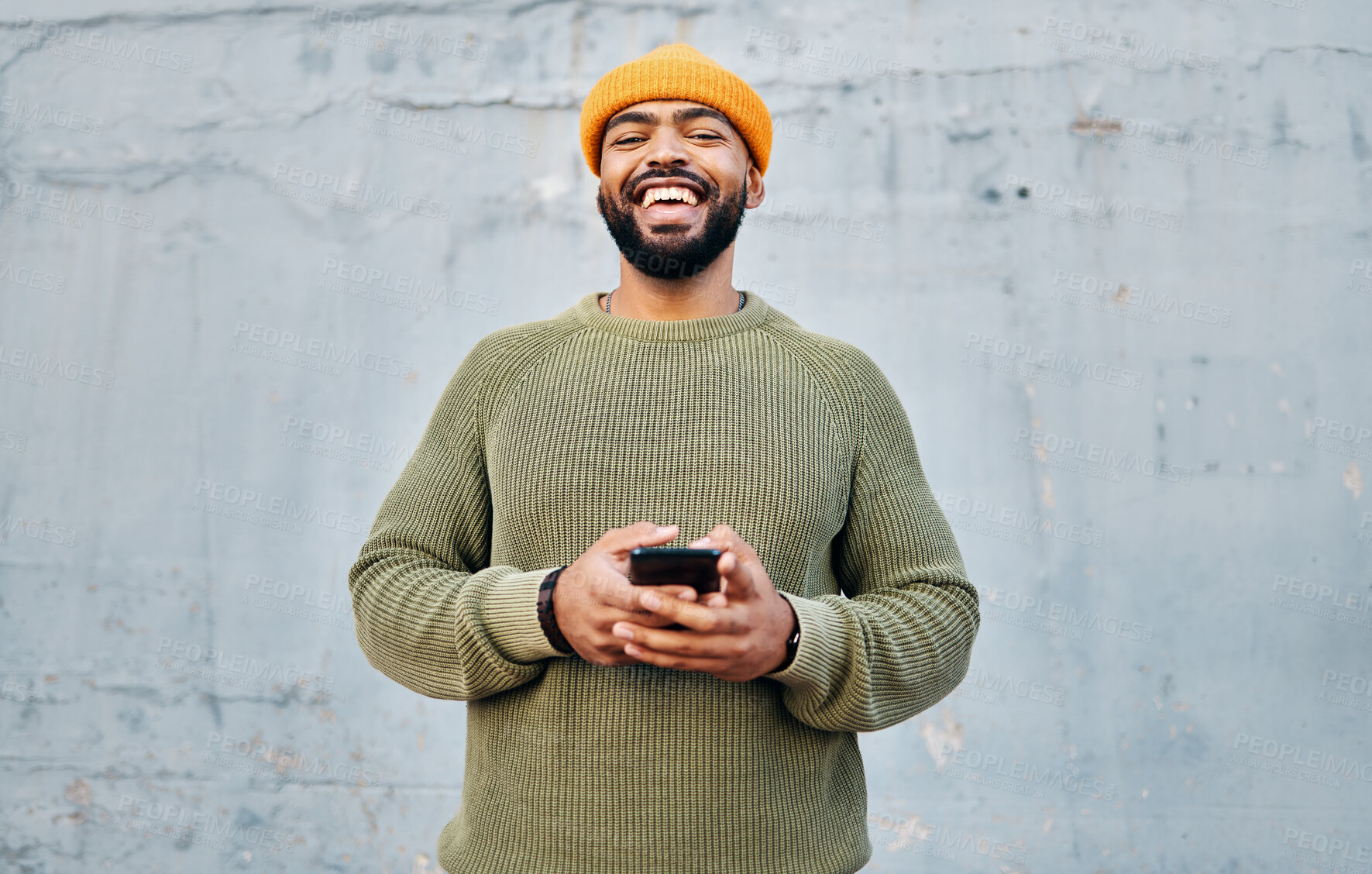 Buy stock photo Phone, happy and portrait of man by wall networking on social media, mobile app or the internet. Technology, smile and person from Colombia scroll on website with cellphone in city by gray background