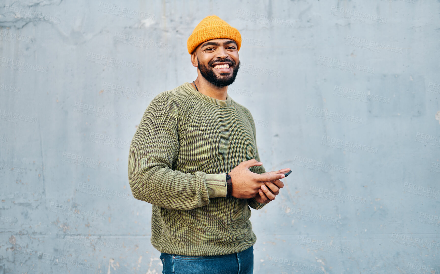 Buy stock photo Phone, smile and portrait of man by wall networking on social media, mobile app or the internet. Technology, happy and person from Colombia scroll on website with cellphone in city by gray background