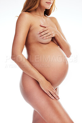 Buy stock photo Naked body, stomach of pregnant woman in studio and ivf wellness, aesthetic beauty and healthy glow on mom. Motherhood, pregnancy care and abdomen of nude new mother isolated on white background.