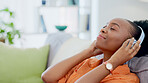 Music headphones, relax or black woman on couch streaming a song or calm sound on radio playlist. African girl, peace or happy zen person listening to a podcast audio on subscription on home sofa