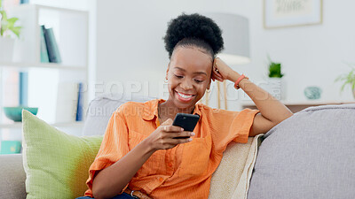 Buy stock photo Happy, black woman and typing on smartphone on sofa, reading social media post and mobile chat at home. Cellphone, app and download digital games, scroll multimedia connection and online subscription