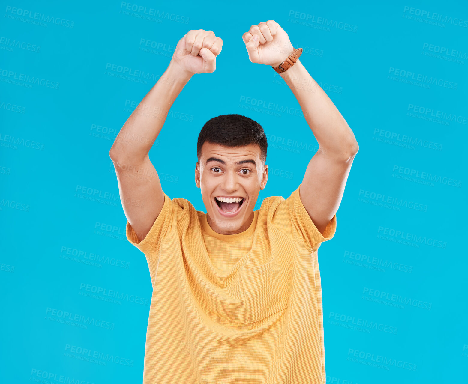 Buy stock photo Man, winner and yes for student success, college news and celebration for winning, goals or achievement in studio. Happy portrait of young person in wow, excited and fist for power on blue background