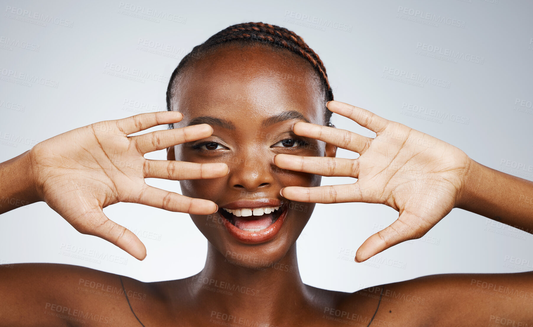 Buy stock photo Wellness, hands and portrait of black woman for skincare, beauty reveal and excited on a studio background. Smile, young and African person with a gesture for clean facial skin or a dermatology glow