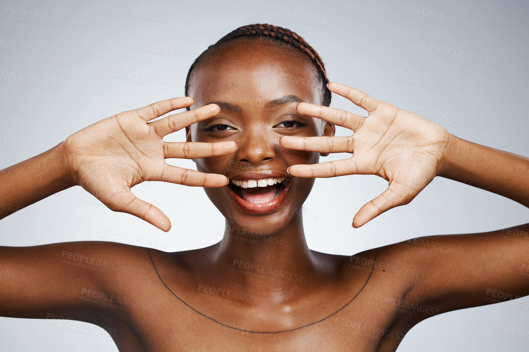 Buy stock photo Happy, hands and portrait of black woman for skincare, beauty reveal and excited on a studio background. Smile, young and an African person with a gesture for clean facial skin or a dermatology glow