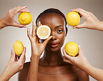 Hands, lemon and natural beauty, black woman in portrait for wellness and sustainable skincare on brown background. Health, nutrition and fruit, dermatology and vegan product with vitamin c in studio