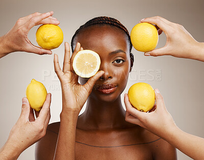 Buy stock photo Hands, lemon and natural beauty, black woman in portrait for wellness and sustainable skincare on brown background. Health, nutrition and fruit, dermatology and vegan product with vitamin c in studio