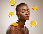 Black woman, skincare and face with orange, vitamin c and cosmetics for healthy skin, eyes closed and facial treatment. Wellness, glow and dermatology for natural ingredients, vegan care and citrus