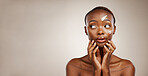 Beauty, thinking and black woman with cosmetics, cream and wellness on grey studio background. African person, dermatology and model with creme, aesthetic and skincare with self care and mockup space