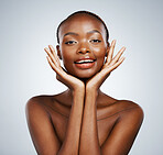 Black woman, face in hands and natural beauty with cosmetics, dermatology and glow on white background. Wellness, skincare and happy model in portrait, facial and shine with clean skin in studio