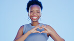Face, heart hands and black woman with support, kindness and feedback on a blue background. Portrait, African person and model with symbol for love, respect and care with review, wellness and hope