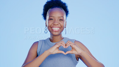 Buy stock photo Face, heart hands and black woman with support, kindness and feedback on a blue background. Portrait, African person and model with symbol for love, respect and care with review, wellness and hope
