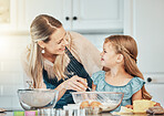 Happy woman in kitchen, baking together with child and teaching, learning and nutrition with mother. Smile, mom and girl kid helping make cookies in home with care, support and love at breakfast.