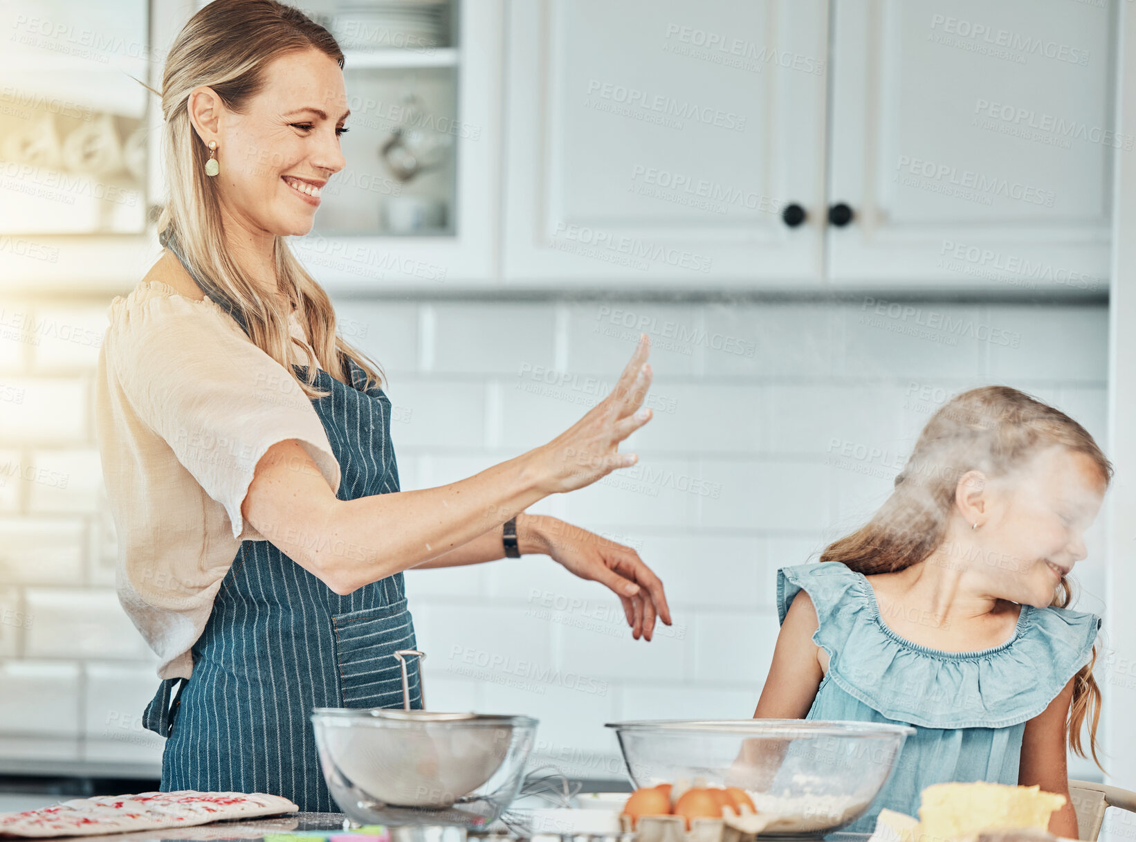 Buy stock photo Mother and daughter, baking and smile with flour in kitchen and love by bonding. Happy family, fresh ingredients and fun in learning, cake and dessert or play for breakfast, snacks and food at home