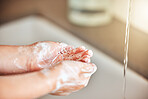 Soap, washing hands and kid by sink for cleaning, hygiene and wellness in bathroom at home. Health, child development and palms of young girl with water for protection for germs, virus and bacteria