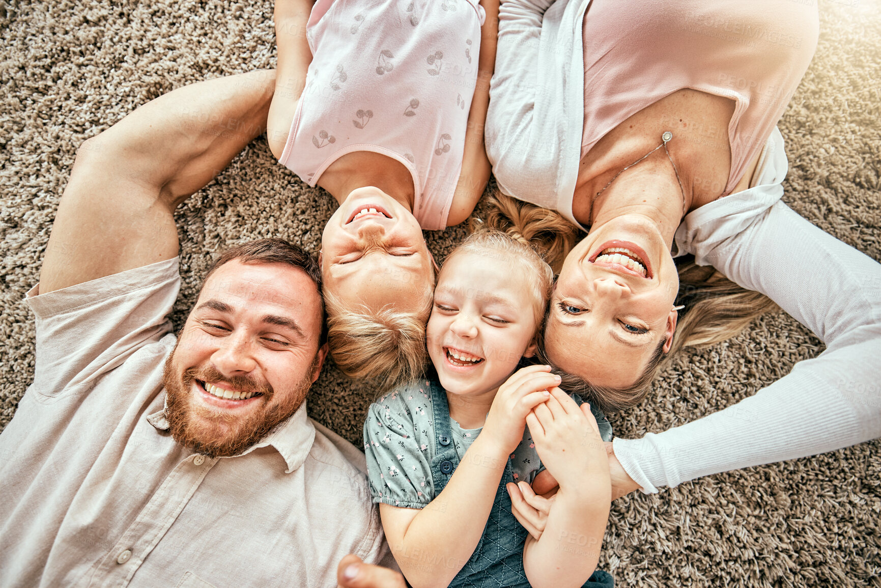 Buy stock photo Smile, portrait and kids with parents in the living room bonding and relaxing together at home. Happy, love and girl children laying with mother and father from Australia on floor in lounge at house.