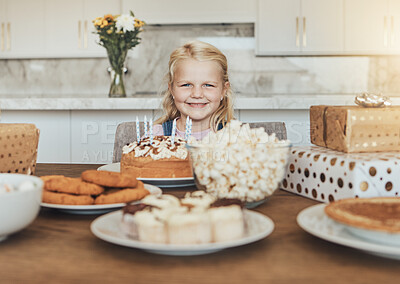Child, birthday cake and celebration with gifts, home or smile for food, desserts or happy. Portrait, party or kitchen for girl, candles or face for special, excited and giving to eat, enjoy or snack