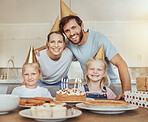 Portrait of happy family, children and birthday cake for celebration with candles, love or sweets in home. Parents smile, face of mother and father together at table at girl kids party event in house