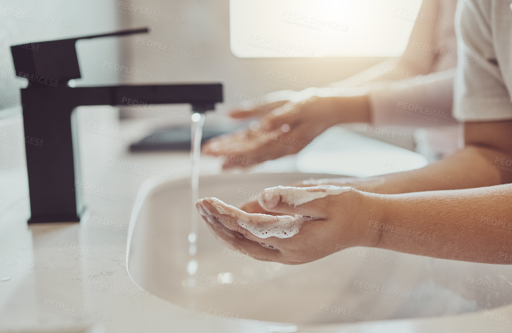 Buy stock photo Bathroom, water and child cleaning hands with soap, foam or learning healthy hygiene together. Washing dirt, germs or bacteria on fingers, kid in home in morning for wellness, safety or skin care.